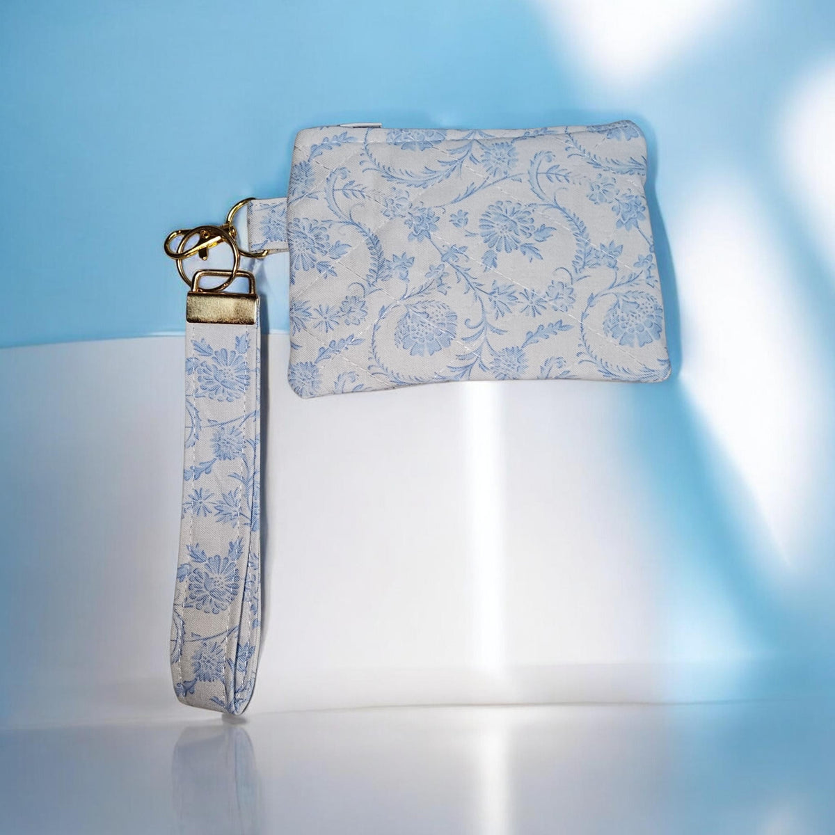 Light Blue scroll print wristlet and quilted zipper wallet