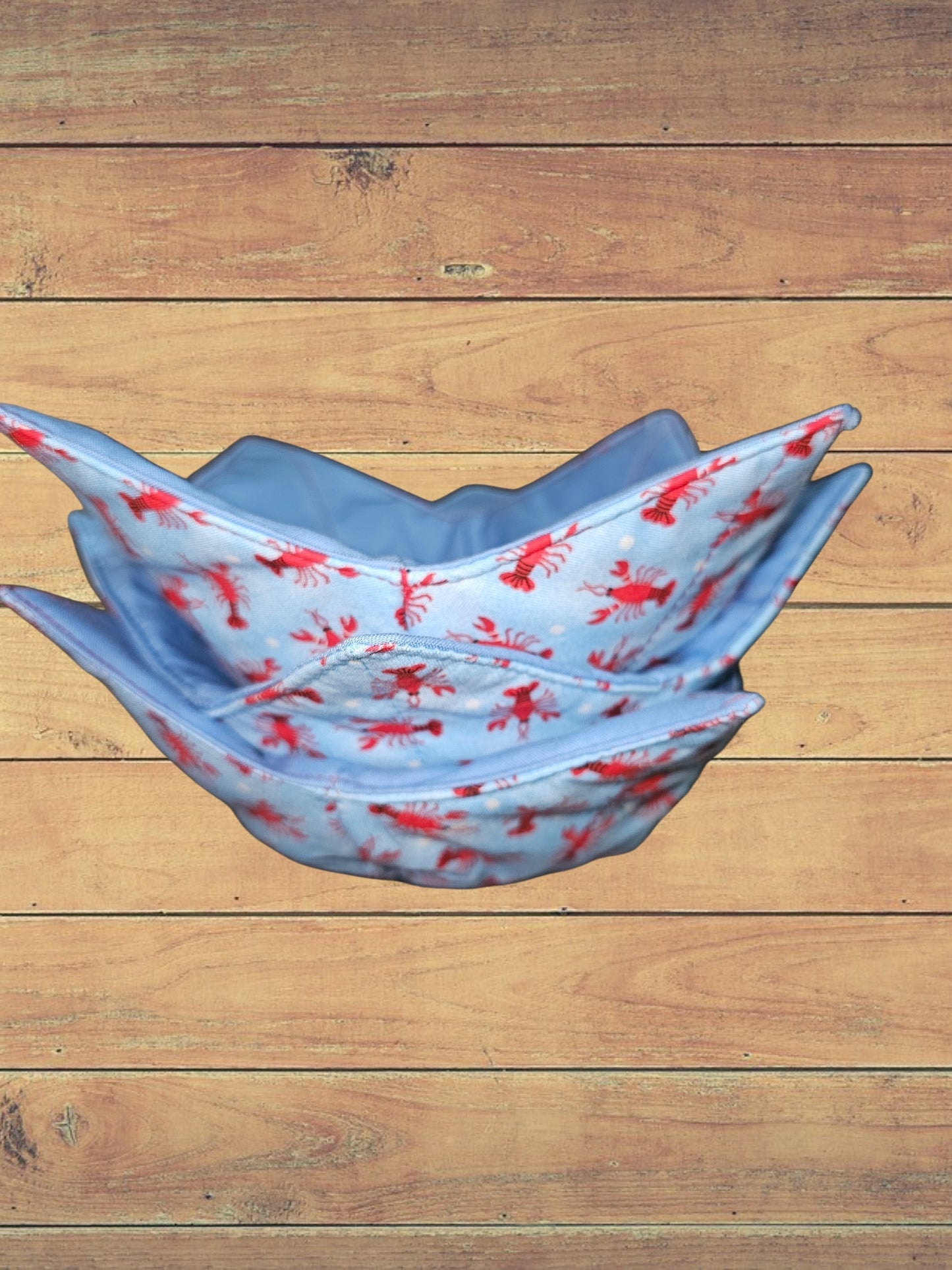 Medium crawfish on blue bowl cozy