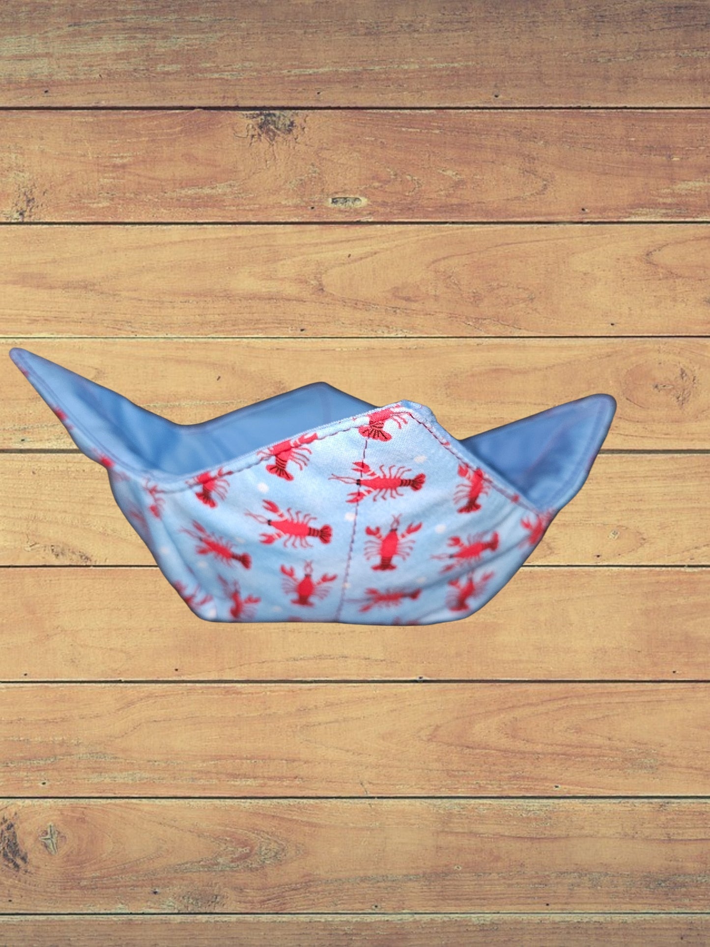 Medium crawfish on blue bowl cozy